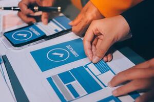 The designer team is designing the uxui system to make the uxui system work well on new phones and support system updates. Website development concept UI UX front end designer photo