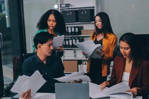 Stress, business people and employee frustrated with multitasking, pressure or overworked by team in chaos with paperwork. Anxiety, headache and worker overwhelmed by group and burnout in crisis photo
