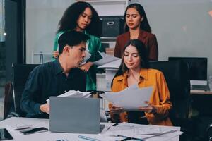 Stress, business people and employee frustrated with multitasking, pressure or overworked by team in chaos with paperwork. Anxiety, headache and worker overwhelmed by group and burnout in crisis photo