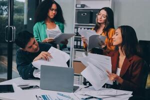 Stress, business people and employee frustrated with multitasking, pressure or overworked by team in chaos with paperwork. Anxiety, headache and worker overwhelmed by group and burnout in crisis photo