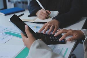 Team of business people are meeting to analyze data for marketing plan,Market research reports and income statistics, Financial and Accounting concept. photo