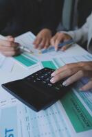 Team of business people are meeting to analyze data for marketing plan,Market research reports and income statistics, Financial and Accounting concept. photo
