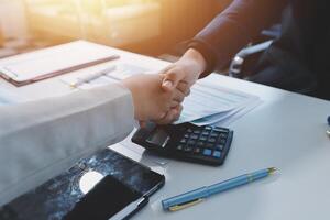 Business handshake for teamwork of business merger and acquisition,successful negotiate,hand shake,two businessman shake hand with partner to celebration partnership and business deal concept photo
