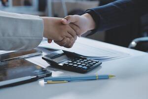 Business handshake for teamwork of business merger and acquisition,successful negotiate,hand shake,two businessman shake hand with partner to celebration partnership and business deal concept photo