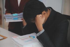 Audit concept,Administrator business man financial inspector and secretary making report calculating balance. Internal Revenue Service checking document. photo