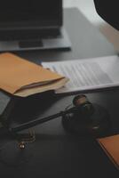 Law theme, gavel or mallet of the judge, lawyer enforcement officers, evidence-based cases taken into account in the court abount business, legislation. photo