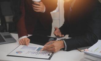 Audit concept,Administrator business man financial inspector and secretary making report calculating balance. Internal Revenue Service checking document. photo