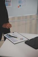 Audit concept,Administrator business man financial inspector and secretary making report calculating balance. Internal Revenue Service checking document. photo