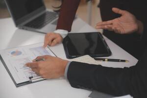Audit concept,Administrator business man financial inspector and secretary making report calculating balance. Internal Revenue Service checking document. photo