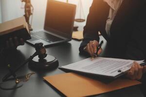 Law theme, gavel or mallet of the judge, lawyer enforcement officers, evidence-based cases taken into account in the court abount business, legislation. photo