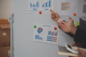 Audit concept,Administrator business man financial inspector and secretary making report calculating balance. Internal Revenue Service checking document. photo