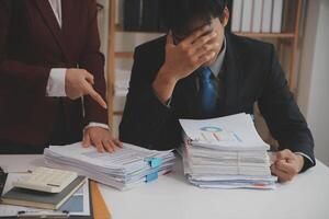 Audit concept,Administrator business man financial inspector and secretary making report calculating balance. Internal Revenue Service checking document. photo