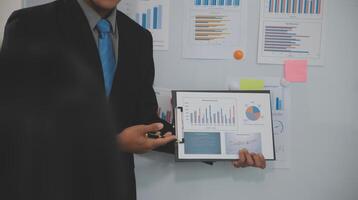 Audit concept,Administrator business man financial inspector and secretary making report calculating balance. Internal Revenue Service checking document. photo