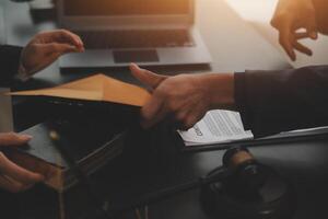 Law theme, gavel or mallet of the judge, lawyer enforcement officers, evidence-based cases taken into account in the court abount business, legislation. photo