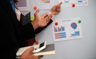 Audit concept,Administrator business man financial inspector and secretary making report calculating balance. Internal Revenue Service checking document. photo