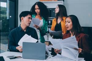 Stress, business people and employee frustrated with multitasking, pressure or overworked by team in chaos with paperwork. Anxiety, headache and worker overwhelmed by group and burnout in crisis photo
