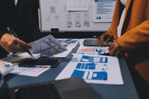 The designer team is designing the uxui system to make the uxui system work well on new phones and support system updates. Website development concept UI UX front end designer photo