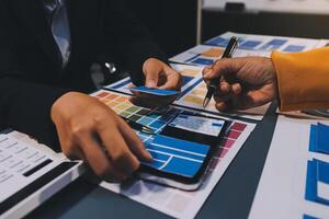 The designer team is designing the uxui system to make the uxui system work well on new phones and support system updates. Website development concept UI UX front end designer photo