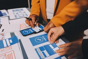 The designer team is designing the uxui system to make the uxui system work well on new phones and support system updates. Website development concept UI UX front end designer photo