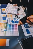 The designer team is designing the uxui system to make the uxui system work well on new phones and support system updates. Website development concept UI UX front end designer photo