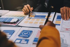 The designer team is designing the uxui system to make the uxui system work well on new phones and support system updates. Website development concept UI UX front end designer photo