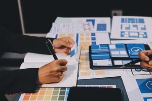 The designer team is designing the uxui system to make the uxui system work well on new phones and support system updates. Website development concept UI UX front end designer photo