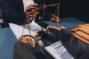 Judge gavel with Justice lawyers having team meeting at law firm background. Concepts of Law and Legal services. photo