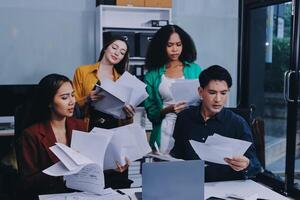 Stress, business people and employee frustrated with multitasking, pressure or overworked by team in chaos with paperwork. Anxiety, headache and worker overwhelmed by group and burnout in crisis photo