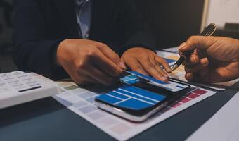 The designer team is designing the uxui system to make the uxui system work well on new phones and support system updates. Website development concept UI UX front end designer photo