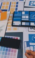 The designer team is designing the uxui system to make the uxui system work well on new phones and support system updates. Website development concept UI UX front end designer photo