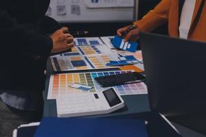 The designer team is designing the uxui system to make the uxui system work well on new phones and support system updates. Website development concept UI UX front end designer photo