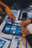 The designer team is designing the uxui system to make the uxui system work well on new phones and support system updates. Website development concept UI UX front end designer photo