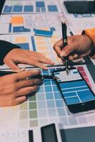 The designer team is designing the uxui system to make the uxui system work well on new phones and support system updates. Website development concept UI UX front end designer photo