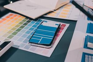 The designer team is designing the uxui system to make the uxui system work well on new phones and support system updates. Website development concept UI UX front end designer photo
