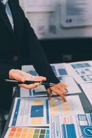 The designer team is designing the uxui system to make the uxui system work well on new phones and support system updates. Website development concept UI UX front end designer photo