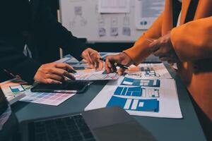The designer team is designing the uxui system to make the uxui system work well on new phones and support system updates. Website development concept UI UX front end designer photo