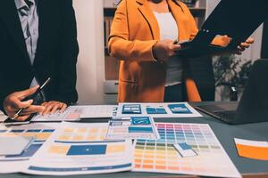 The designer team is designing the uxui system to make the uxui system work well on new phones and support system updates. Website development concept UI UX front end designer photo