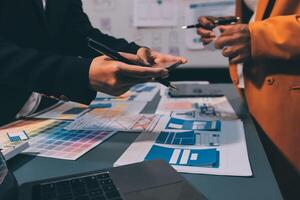 The designer team is designing the uxui system to make the uxui system work well on new phones and support system updates. Website development concept UI UX front end designer photo