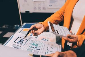 The designer team is designing the uxui system to make the uxui system work well on new phones and support system updates. Website development concept UI UX front end designer photo