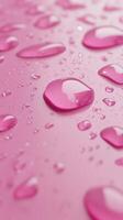 Waterdrop bubble splashing rounded on pink blurred background photo
