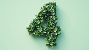 The number 4 is framed by a series of green leaves solid background photo