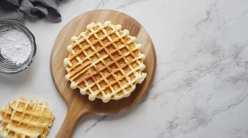 Gluten free flour ingredient waffle crunchy breakfast cake on wooden board photo