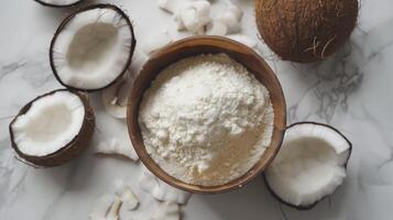 Coconut fruit flour on wooden bowl gluten free for baking flat lay view photo