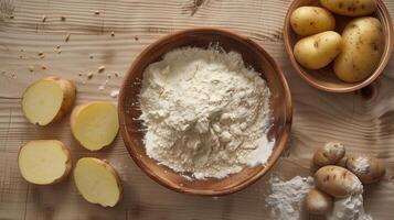 Gluten free potato flour on bowl and some potato decoration flat lay view photo