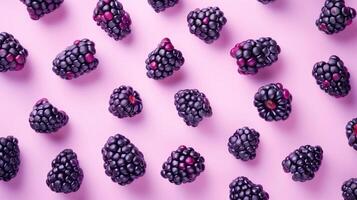 Blackberry fruit pattern seamless on pink solid background photo