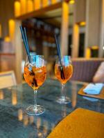 Aperol Spritz - A refreshing Italian cocktail combining Aperol, Prosecco, and a splash of soda, garnished with an orange slice, perfect for warm days and casual gatherings photo