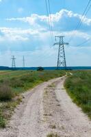 High-voltage power line against the background of the blue sky photo