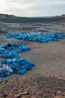 Plastic bottles and various garbage from hotels in the wild, Garbage dump in the desert in Egypt photo