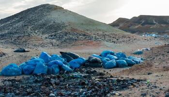 Plastic bottles and various garbage from hotels in the wild, Garbage dump in the desert in Egypt photo