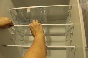 Cleaning cleaning fridge sink wipes the shelf inserts the shelf photo